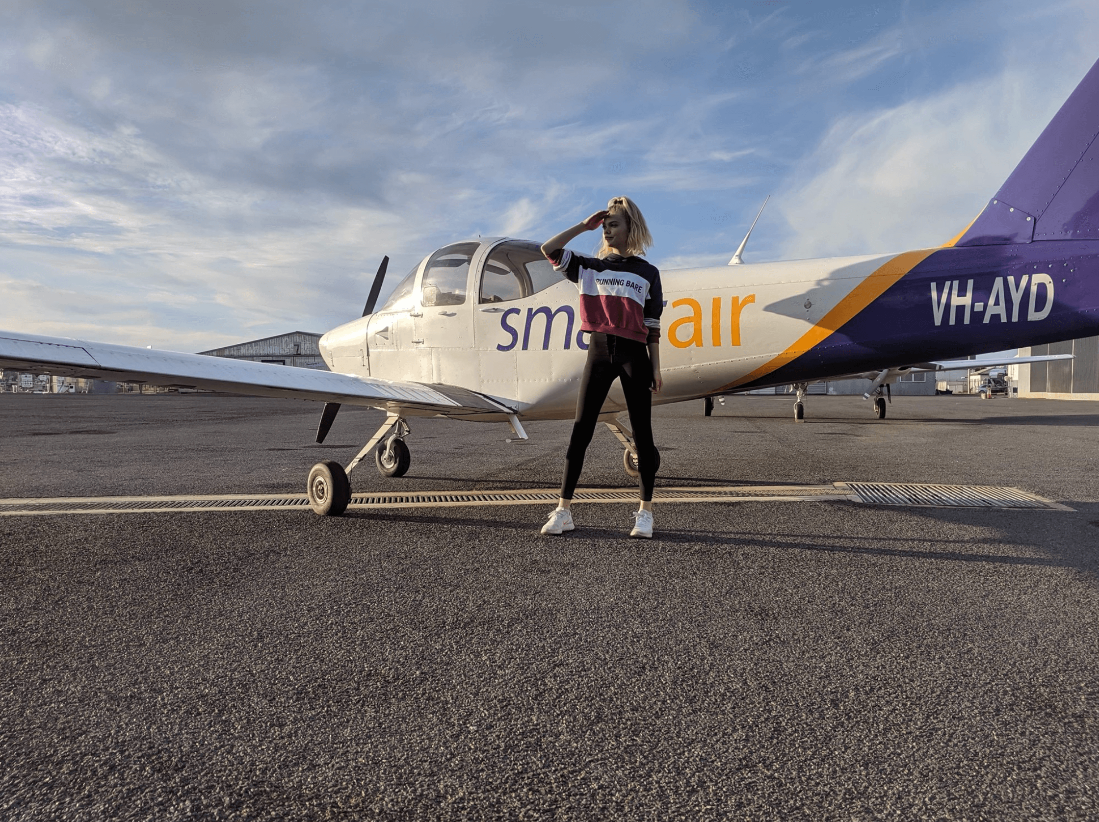 Student in front of plane
