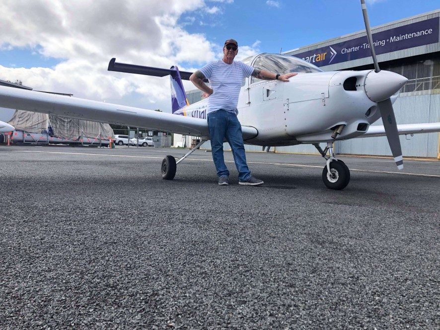 Student in front of tomahawk