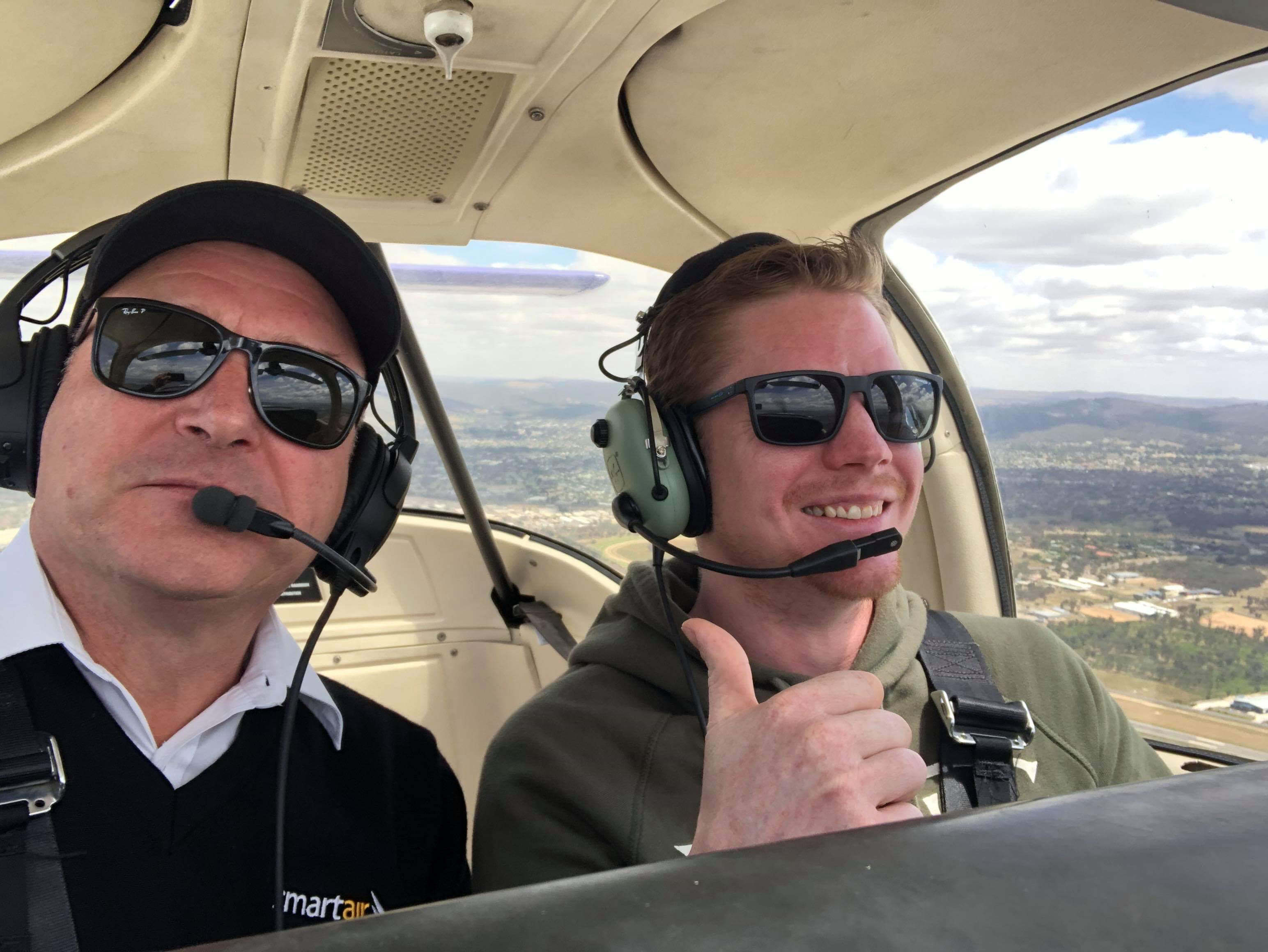 Richard with student thumbs up
